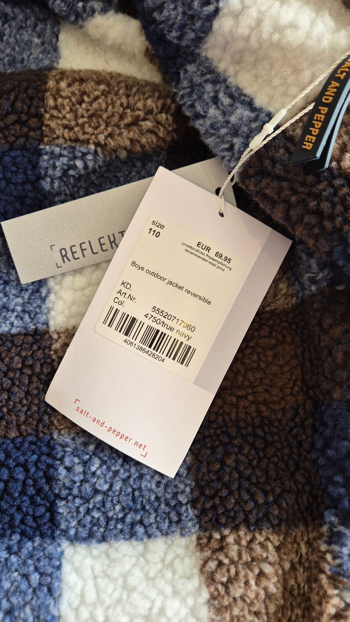 Wichtel Outlet Salt and Pepper reversible fleece jacket in blue and brown checkered pattern with product tag